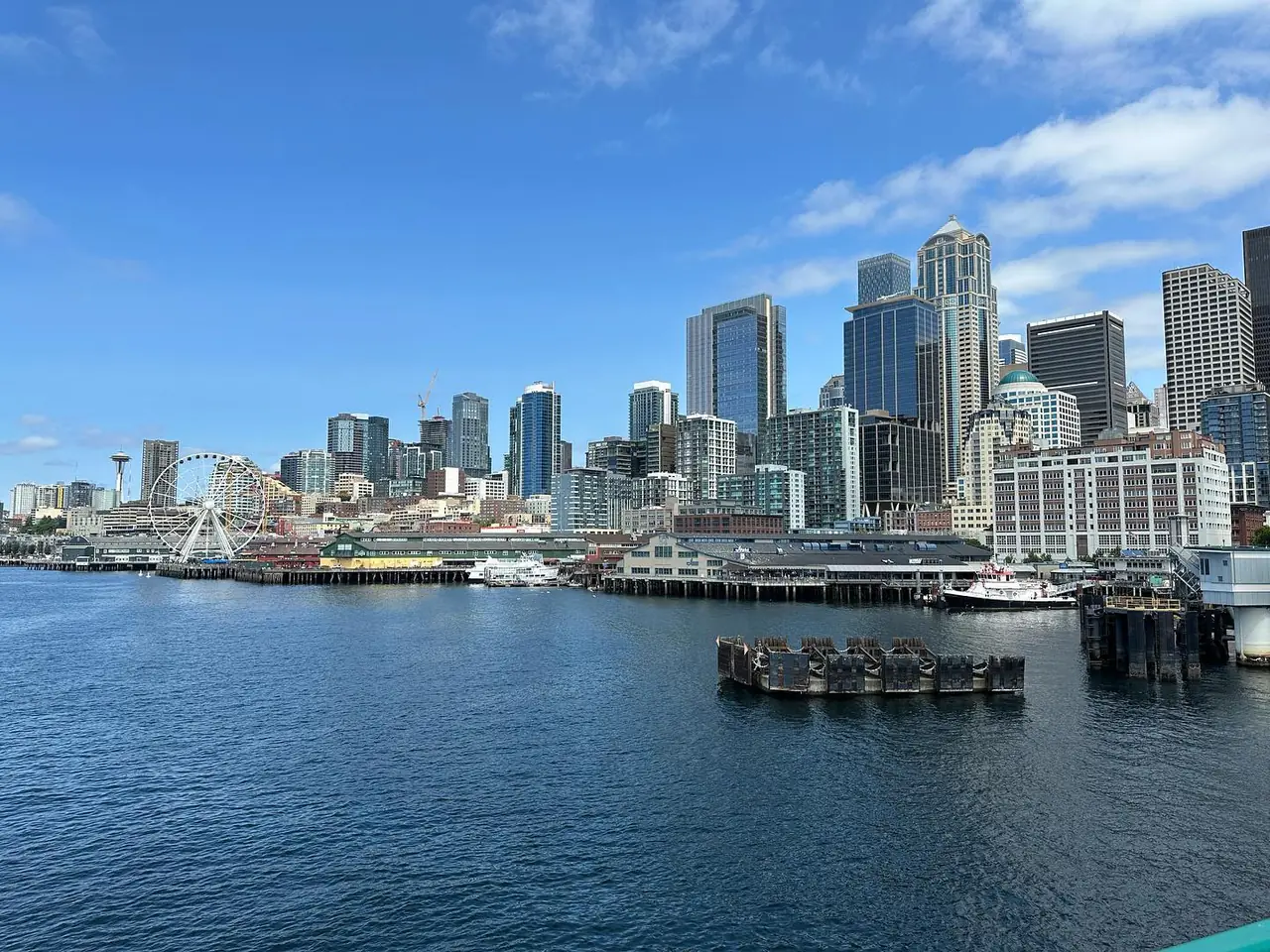 Seattle waterfront, Great Wheel, and skyline seen across the water from a ferry