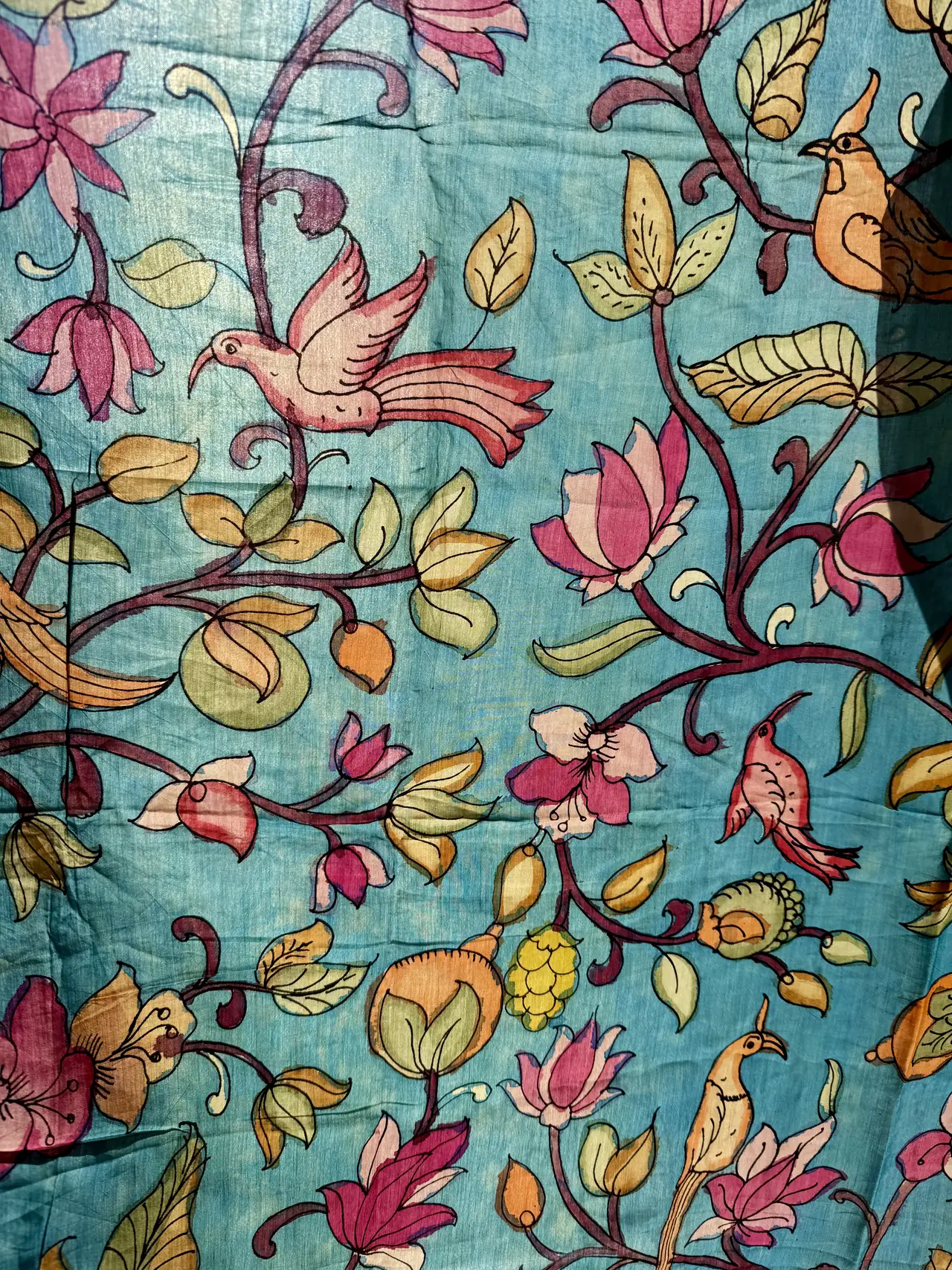 Pink and orange birds among flower creepers on blue hand-painted Kalamkari Bangalore silk