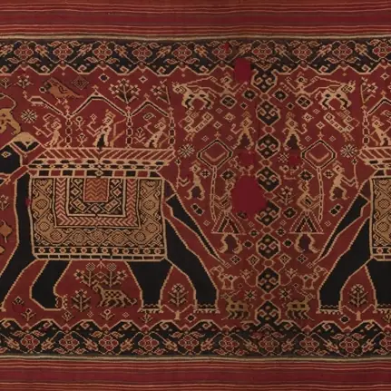 An elephant and surrounding geometric motifs woven in a historic Gujarati silk double-ikat textile