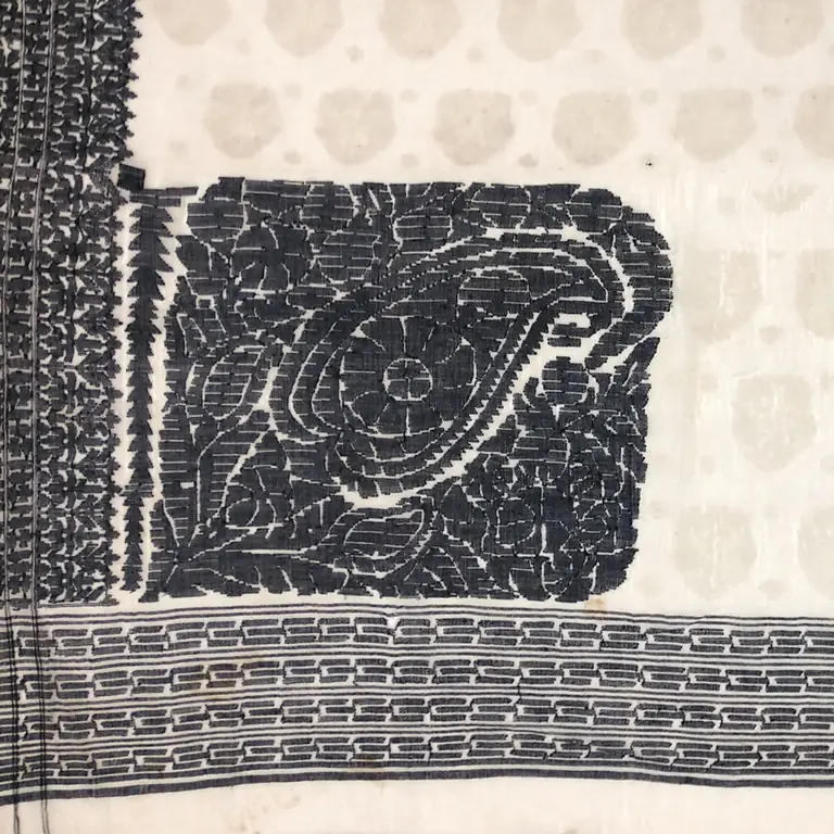 Dark floral and mango-shaped motifs woven into pale Jamdani muslin